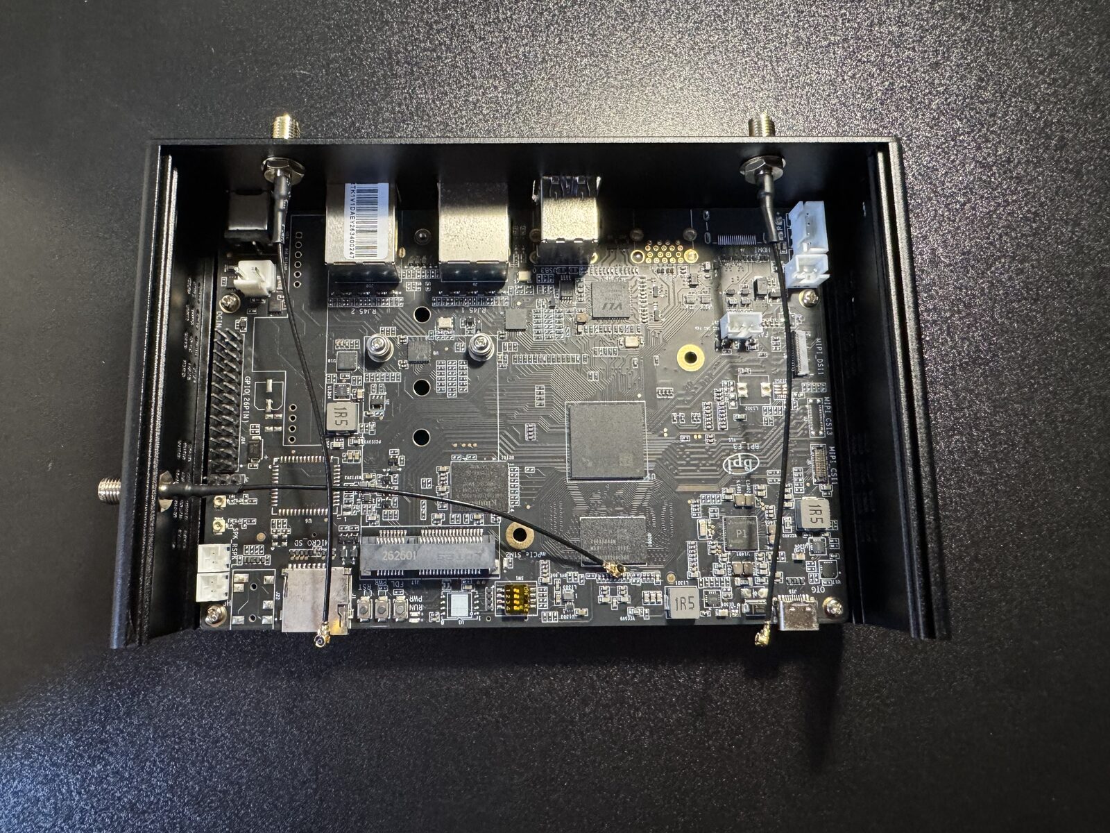 The open router, showing the empty slot and three antenna wires
